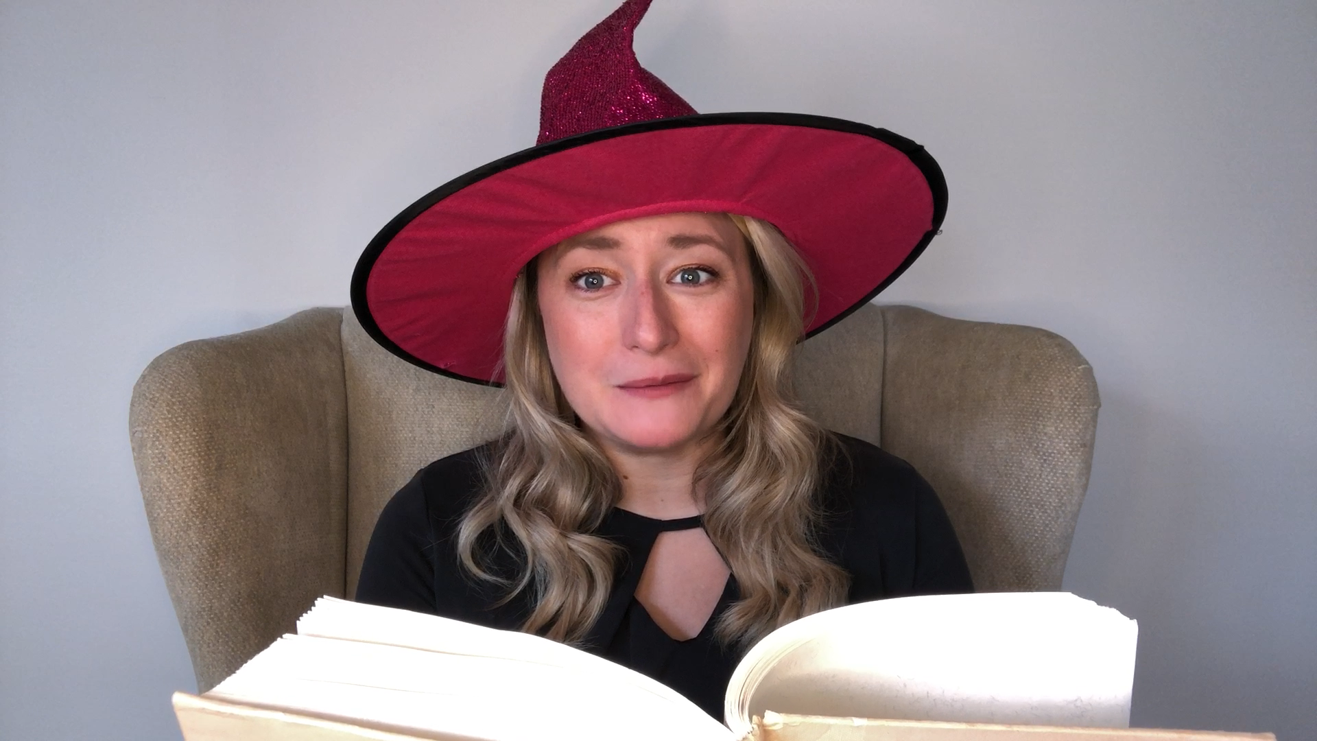 image of Delia telling the Wee Witch Story with a great witch hat on